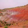 Dramatic colors of wet clay hills.